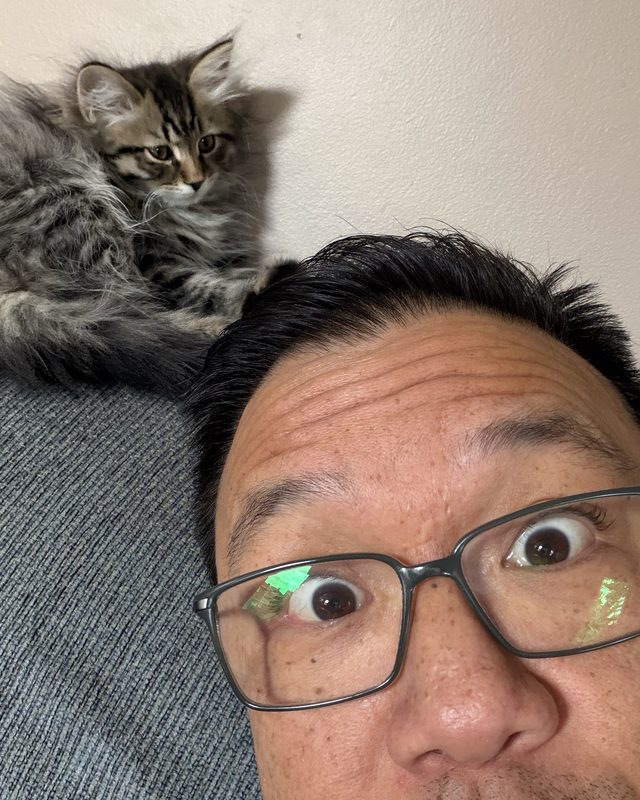 Andy, with his kitten perched behind him